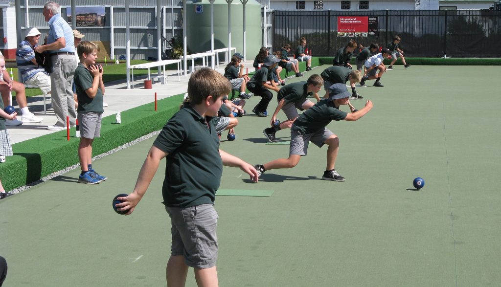 A photo of a Bowls Canterbury school event being held on the Lincoln Carpet green